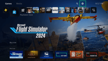 The PS5 homepage, highlighting the gear icon (settings menu) in the top right.