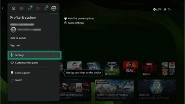 Xbox dashboard showing the “Profile & system” menu with the Settings option highlighted.