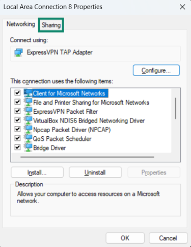 Opening sharing options in ExpressVPN TAP Adapter settings.